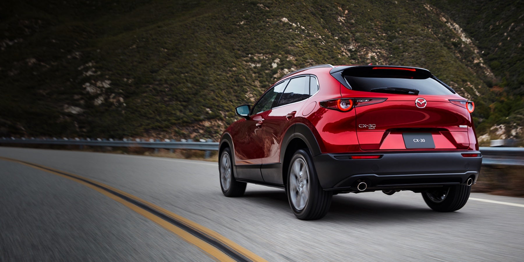Red 2020 Mazda CX-30 Driving on the road | Parkway Family Mazda in Kingwood, TX